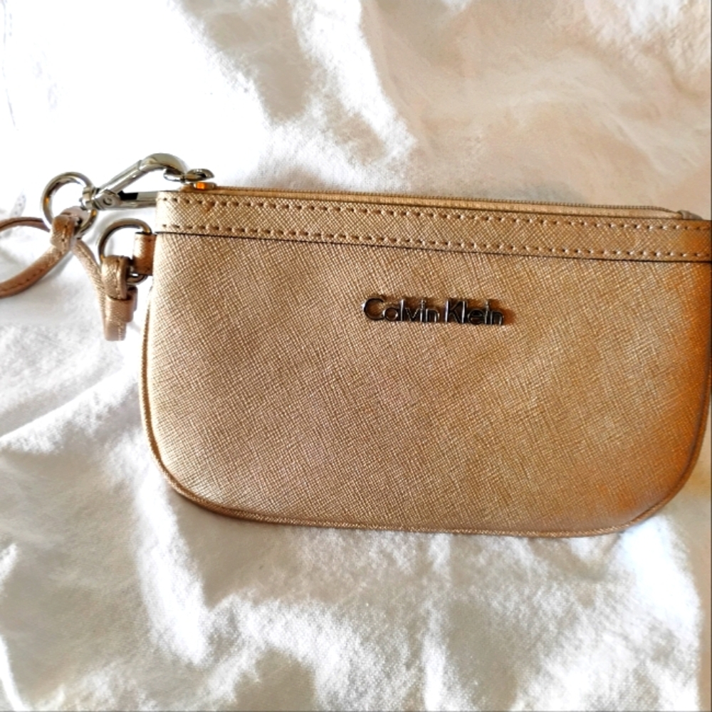 Calvin Klein metallic champagne wristlet​​​​​​​